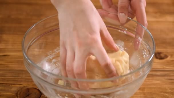 Baker hands kneading dough in glass bowl — Stock Video