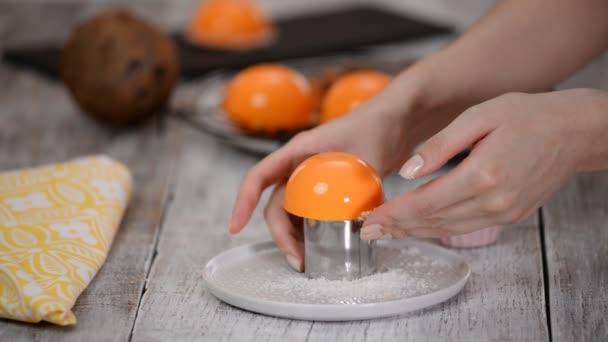 Decorate orange mini cake with nuts. — Stock Video