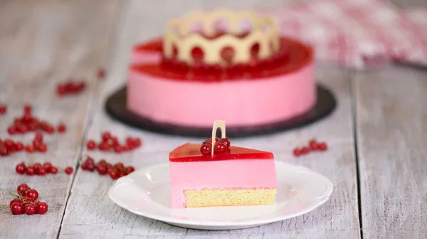 Mousse cake with red currants on white background. — Stock Photo, Image