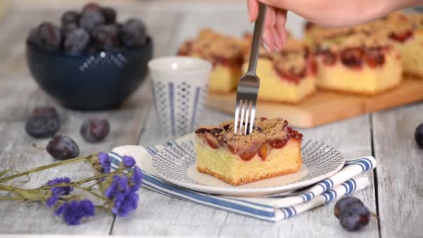 Rustic style. Homemade plum cake on wooden table — Stock Video