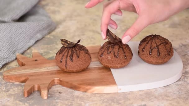 Decorating Choux au Craquelin with chocolate. Delicious French dessert. — Stock Video