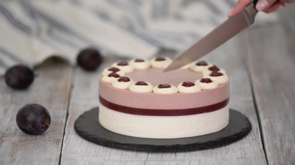 Cutting Delicious Plum Mousse Cake Whipped Cream — Stock Video