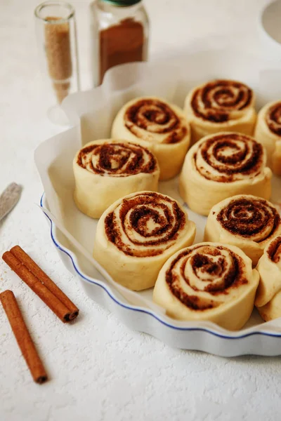 Cinnabon buns. Raw Cinnamon rolls in a baking dish