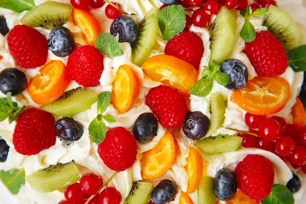 Pavlova cake with cream and fresh summer berries. Close up of Pa