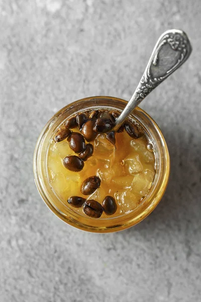 candied fruit jelly. pear marmalade with coffee beans. Jar of pe