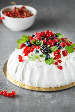 Pavlova cake with cream and fresh summer berries. Close up of Pa clipart
