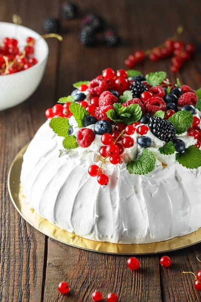 Pavlova cake with cream and fresh summer berries. Close up of Pa