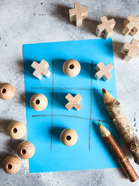 Tic Tac Toe Game Wooden Figures Blue Background — Stock Photo, Image