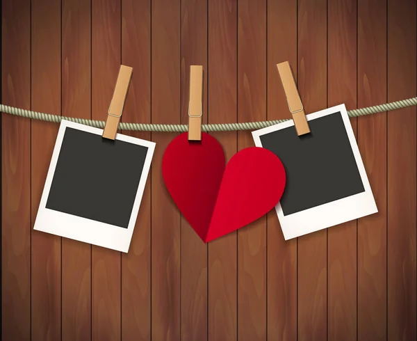 Dos marcos de fotos y corazón para el día de San Valentín colgando de una cuerda en el fondo de madera. Ilustración vectorial. EPS 10 . — Vector de stock