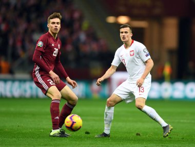 Eylem sırasında Uefa Euro 2020 Roberts Uldrikis (Letonya) Arkadiusz Reca (Polonya) Polonya - Letonya 24 Mart 2019 yılında çizer, Pge Ulusal Stadyumu Varşova, Polonya Varşova Letonya ile 2:0 kazandı.