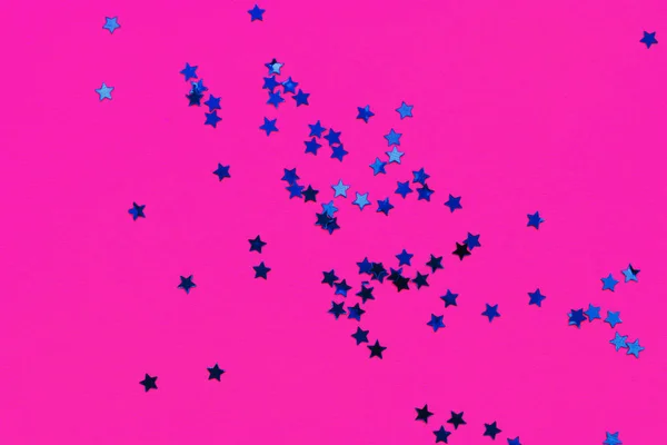 Decorative stars on neon pink background. Holiday and festive co — Stock Photo, Image