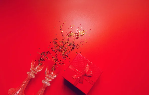 Red background with decorative metallic stars, two vintage glass