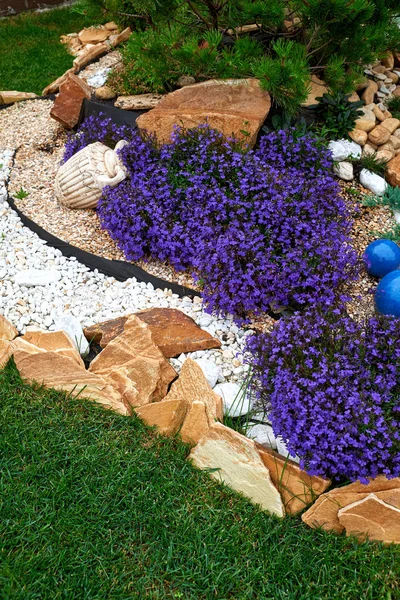 Garden Design. Flowerbed in the yard in landscape design