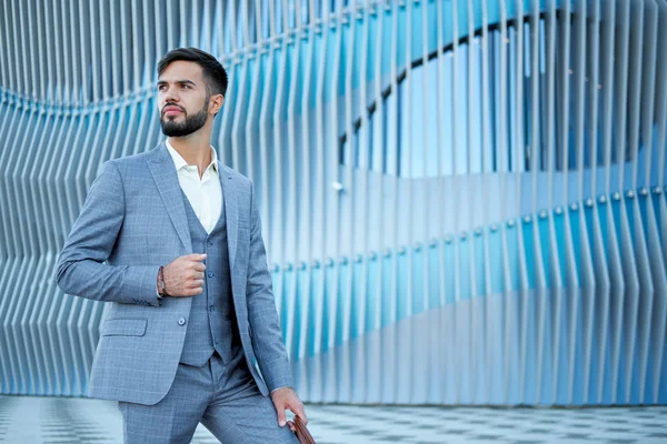 Businessman style. Men style. Man in custom tailored business suit posing outdoors