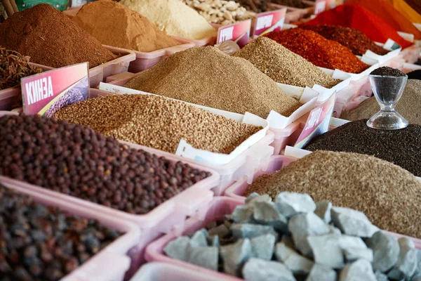 Colorful spices powders and herbs in traditional street market in Central Asia Uzbekistan