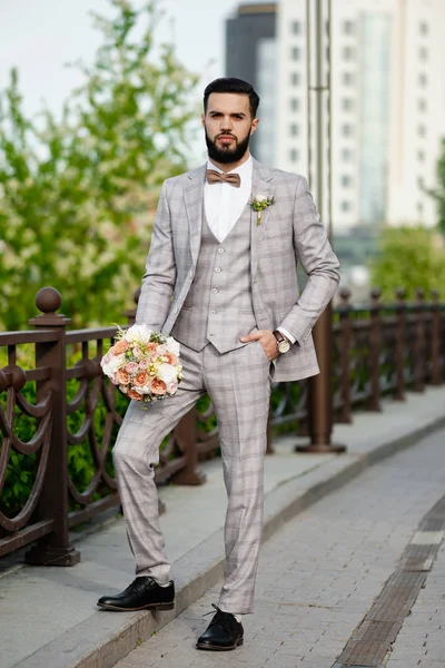 Man Clothed Stylish Suit Holding Bouquet of Flower