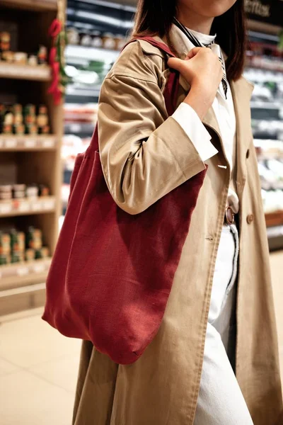 Woman with Eco Fabric Bag in Grocery Supermarket