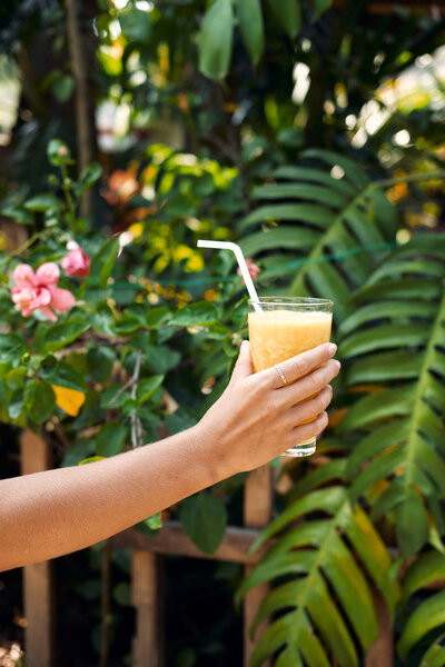 Hand Hold Healthy Pineapple Smoothie Cocktail. Detox Juice