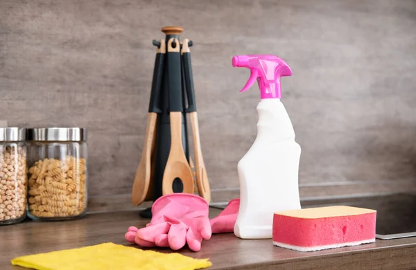 Detergents and cleaning accessories on kitchen. Cleaning and Washing Kitchen. Cleaning service concept