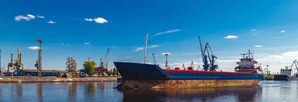 old large cargo ship in a river port