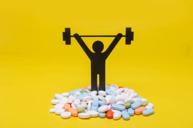 Halter piktogram hapları ve sarı arka plana sahip