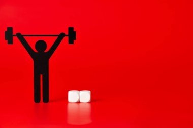 Siyah ağırlık çalışan piktogram kırmızı zemin üzerine beyaz etiketlenmemiş küpleriyle