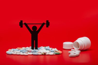 Ağırlık kaldırma piktogram hapları ve kırmızı arka plan ile