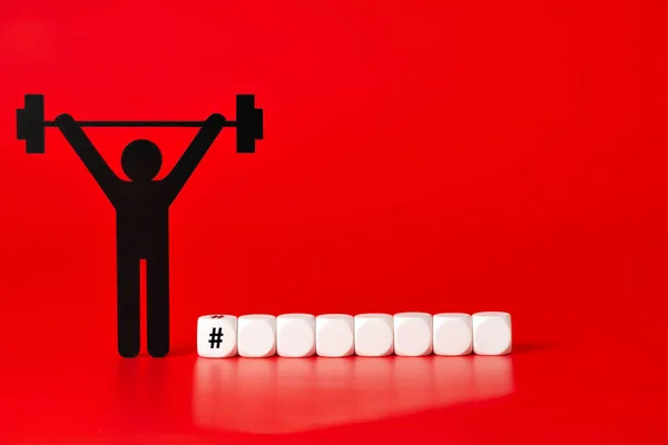 Black Weight Lifter Pictogram White Unlabeled Cubes Red Background — Stock Photo, Image