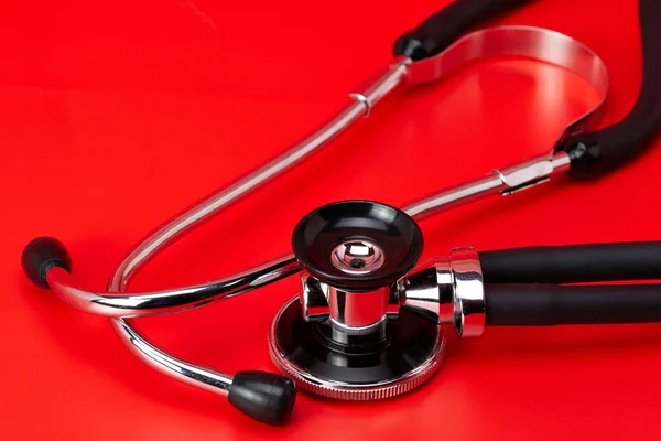 Stethoscope Medical Instrument Close Isolated Red Background — Stock Photo, Image