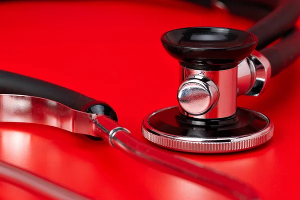 Stethoscope Medical Instrument Close Isolated Red Background — Stock Photo, Image