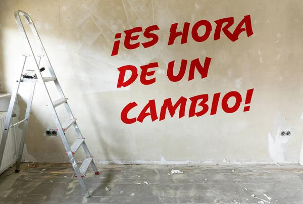 Renovation of a room, symbolic of a new beginning or time for something new. (Spanish: Time to change)