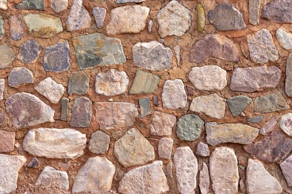 Деталь природной каменной стены, как фон — стоковое фото