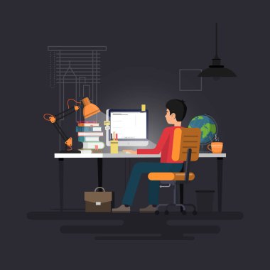 Bilgisayarla çalışma masasında çalışan adam.