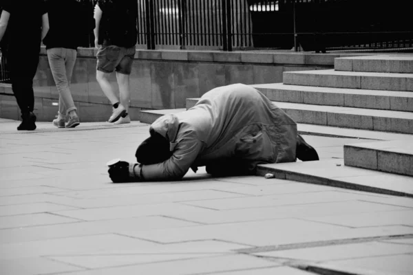 Unhappy homeless man asking help — Stock Photo, Image