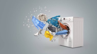Washing machine and flying clothes on grey background clipart