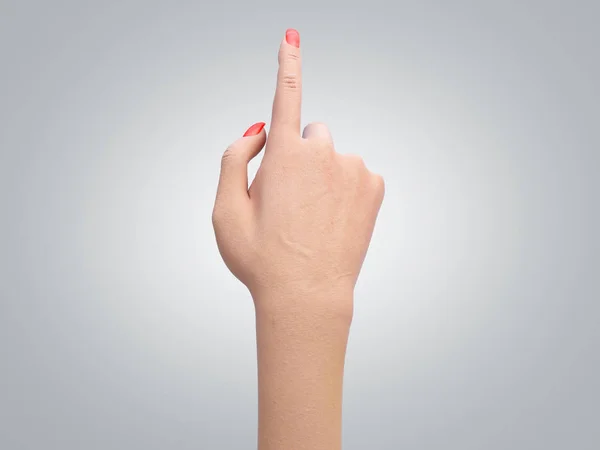 Жіноча рука торкається або вказує на щось 3d рендерингу на сірому — стокове фото