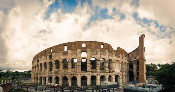 Mad clouds and Colisseum old building in Rome city, Italy