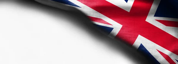 Ткань флага Великобритании на белом фоне - флаг в правом верхнем углу — стоковое фото