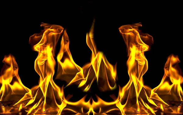 Fire flame with sparks on a black background — Stock Photo, Image