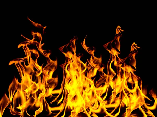 Fire flame with sparks on a black background — Stock Photo, Image