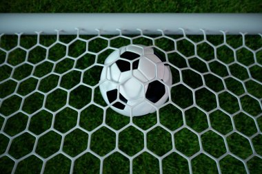 3D render futbol topu kalede. NET spot ve stadyum açık renkli, başarı kavramı ile futbol topu. Yeşil çim futbol