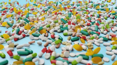 Birçok farklı renkli tablet, mavi arka planda kapsüller. Sağlık hizmeti konsepti. Hapların içinde antibiyotikler, vitaminler. Eczaneden gelen eşyalar. İlaç şirketi, endüstri, 3 boyutlu illüstrasyon.