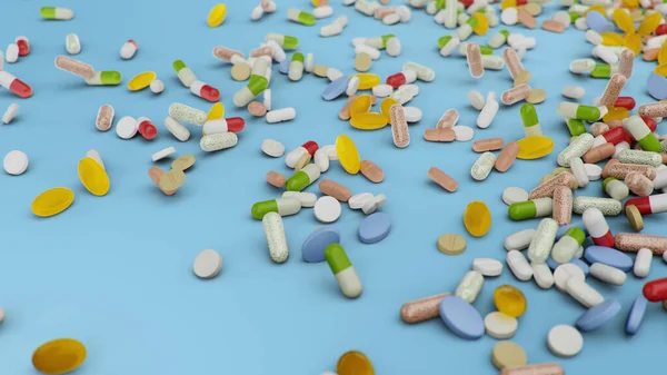 Wiele różnych kolorowych tabletek, kapsułki na niebieskim tle. Koncepcja opieki zdrowotnej. Antybiotyki w tabletkach, witaminy. Towar z apteki. Firma farmaceutyczna, przemysł, ilustracja 3D — Zdjęcie stockowe