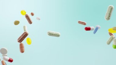 Yavaş hareket animasyonu, uçarken birbirine çarpan haplar. Çok renkli kapsüller ve haplar: antibiyotikler, vitaminler, diyet takviyeleri. Nüfus sağlığı konsepti, 4k 3D animasyon
