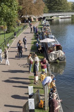 Narrowboats selling goods along the Kennet and Avon canal at Newbury, Berkshire, England UK clipart