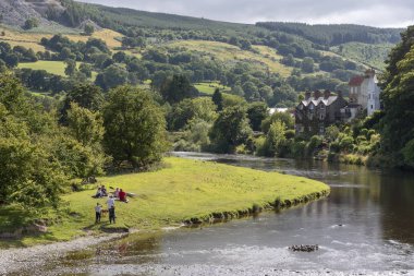 The River Dee at Carrog, Denbighshire, North Wales, Scenic location on the riverside looking southern farmland. clipart