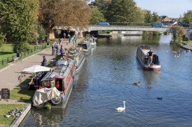 Narrowboats selling goods along the Kennet and Avon canal at Newbury, Berkshire, England UK clipart