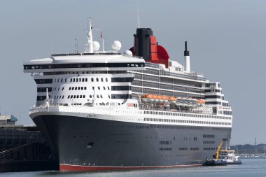  Queen Mary 2 alongside QE 11 Terminal with Seagreen a multi role vessel on a waterside collection of rubbish and recycling materials clipart