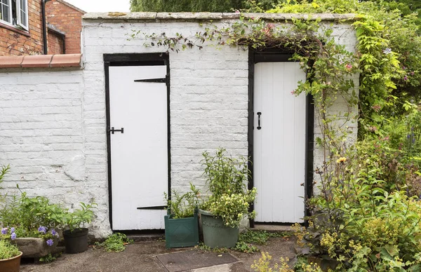 Old Brick Built Shed Two Black White Painted Doors — Stock Photo, Image
