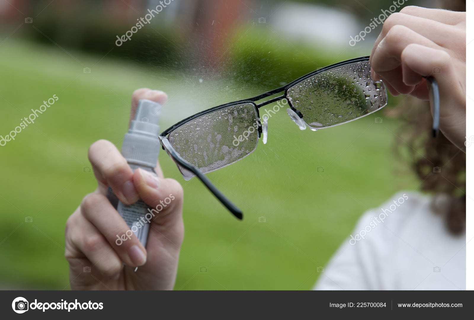 Using Glasses Cleaning Spray Lenses Stock Photo by ©petertt 225700084